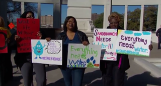 Protesters show support for Sandbranch in front of the downtown Dallas Administration Building Mar. 22, 2016.WFAA-TV/Demond Fernandez via YouTube screenshot